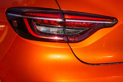 High angle view of illuminated red car on mirror