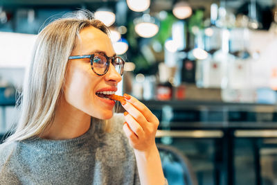 Close-up of young woman smoking cigarette