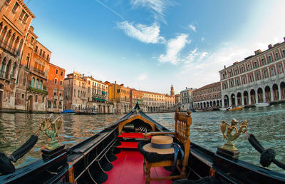 View of boats in canal along buildings