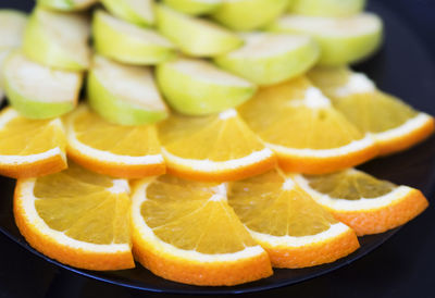 Close-up of orange fruits in plate