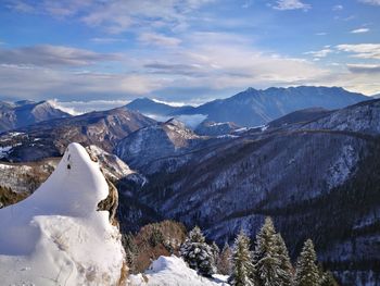 Scenic view of snowcapped mountains against sky