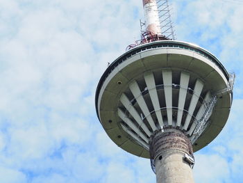 Low angle view of tower against cloudy sky