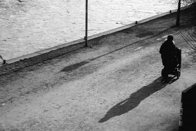 High angle view of man walking on street