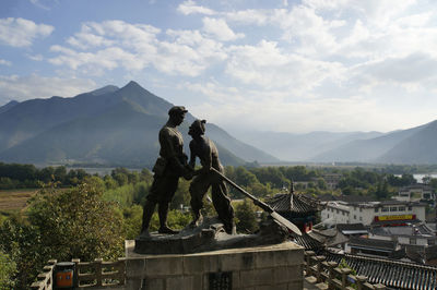 Statue with mountain in background