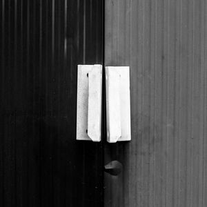 Close-up of open door on wooden table