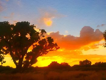 Scenic view of landscape against sky at sunset