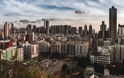 Aerial view of modern buildings in city against sky