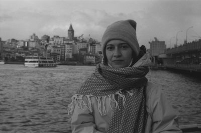 Portrait of woman standing against sky