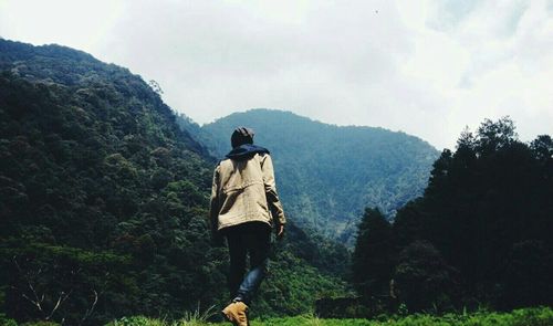 Hiker standing on mountain
