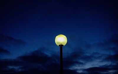 Low angle view of yellow lights against sky