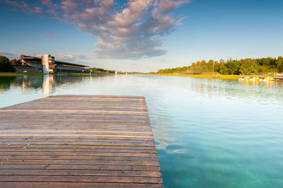 Pier over lake against sky