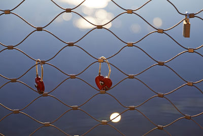 Full frame shot of chainlink fence against sky