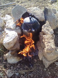 Close-up of bonfire on beach