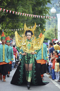 Woman in costume on street during traditional festival