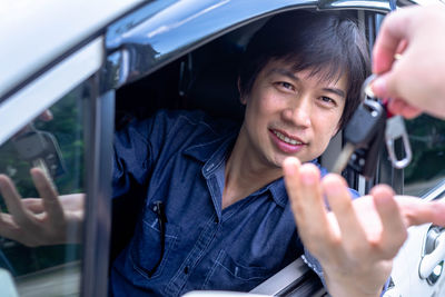 Portrait of young man using mobile phone