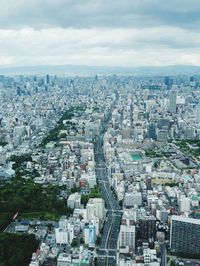 High angle view of buildings in city against sky