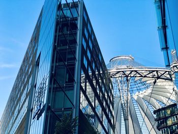 Low angle view of modern building against clear blue sky - sony center, potsdamer platz, berlin