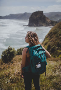 Rear view of woman looking at sea shore