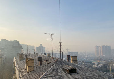 High angle view of buildings and houses against sky