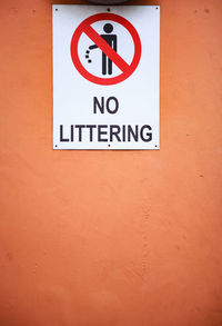 Close-up of warning sign on wall