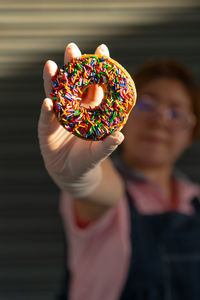 Midsection of man holding ice cream