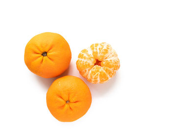 Close-up of orange over white background