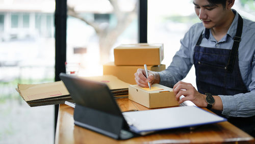 Side view of business colleagues working in office