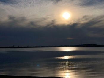 Scenic view of sea against sky at sunset