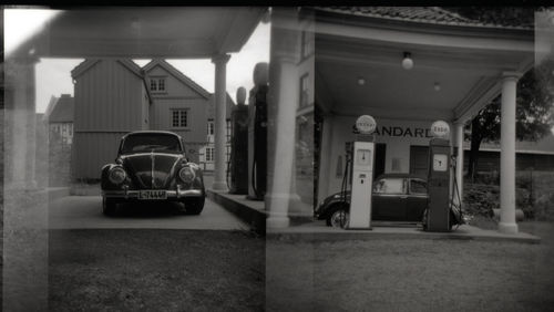 Cars on street amidst buildings in city