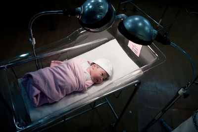 High angle view of baby in incubator