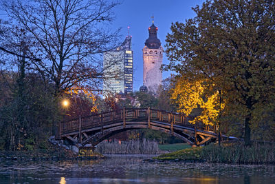 Arch bridge over river in city