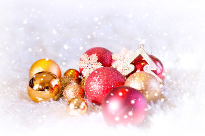 Close-up of christmas ornaments on fur