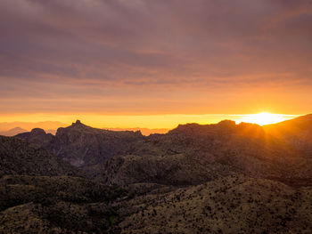 Scenic view of mountains against sky during sunset
