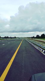 Road by landscape against sky