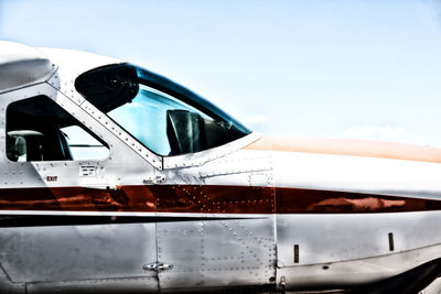 Close-up of airplane against clear sky