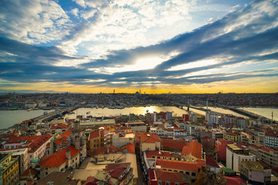 High angle shot of townscape against sky at sunset