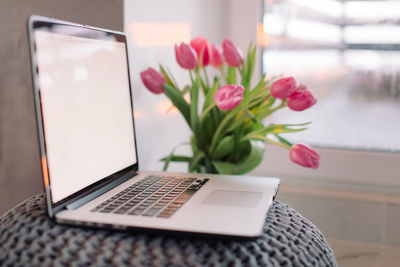 Close-up of flowers on table at home