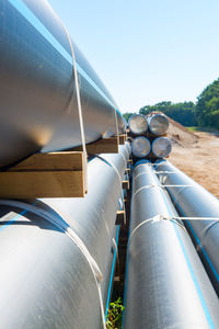 Low angle view of pipes against clear sky