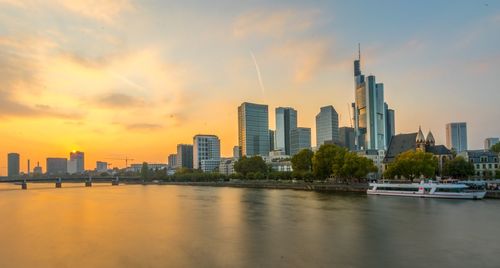 View of buildings in city during sunset