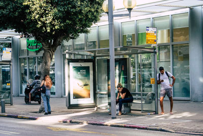 People in front of building