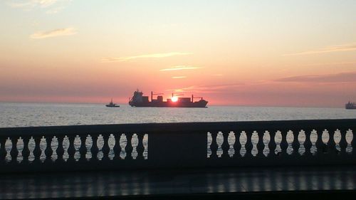 Scenic view of sea at sunset