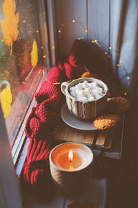 Breakfast with books and sweater on window sill at home