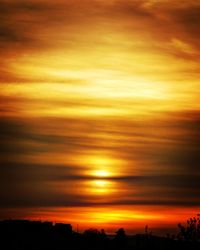 Scenic view of dramatic sky during sunset