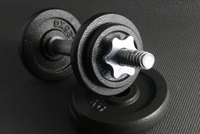 Close-up of dumbbells on table