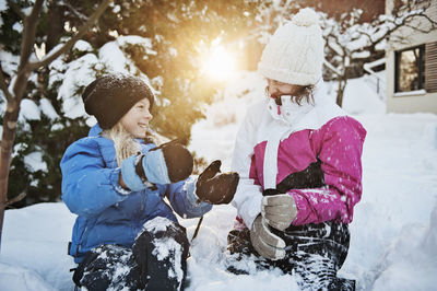 Girls playing at winter, saltsjobaden, nacka, sweden