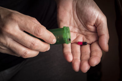 Close-up of man holding hands