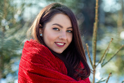 Portrait of smiling young woman in winter