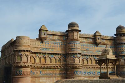 Low angle view of gwalior fort against sky