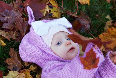 Portrait of cute baby boy leaves