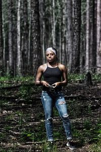 Portrait of young woman in forest